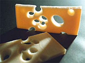 Photo of Vitamin B12 food - Swiss cheese with characteristic holes made by propionibacterium freudenreichii