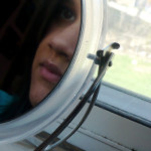 Photo of mirror reflecting a pensive face